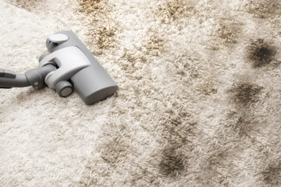 a carpet being vacuumed