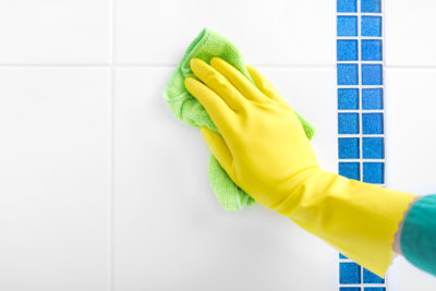 a hand washing tiles