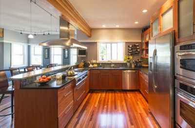 kitchen with hardwood flooring and matching cabinets