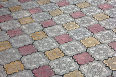intricate pattern of colored floor tiles