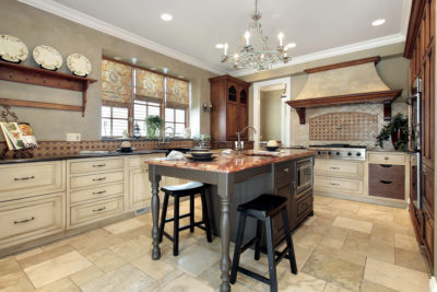 Kitchen with granite island and tile flooring