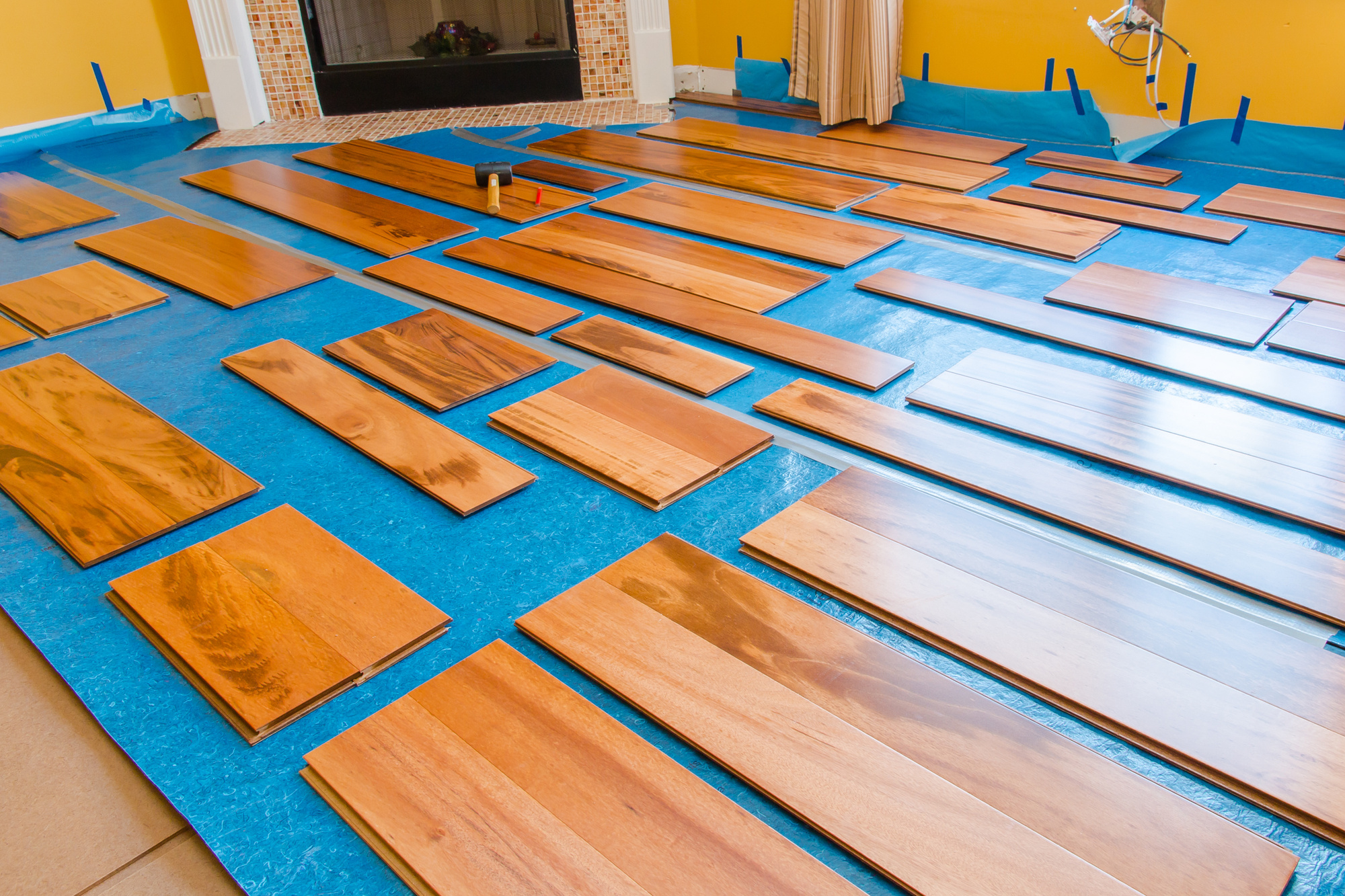 Engineered hardwood flooring planks laid out to be installed My